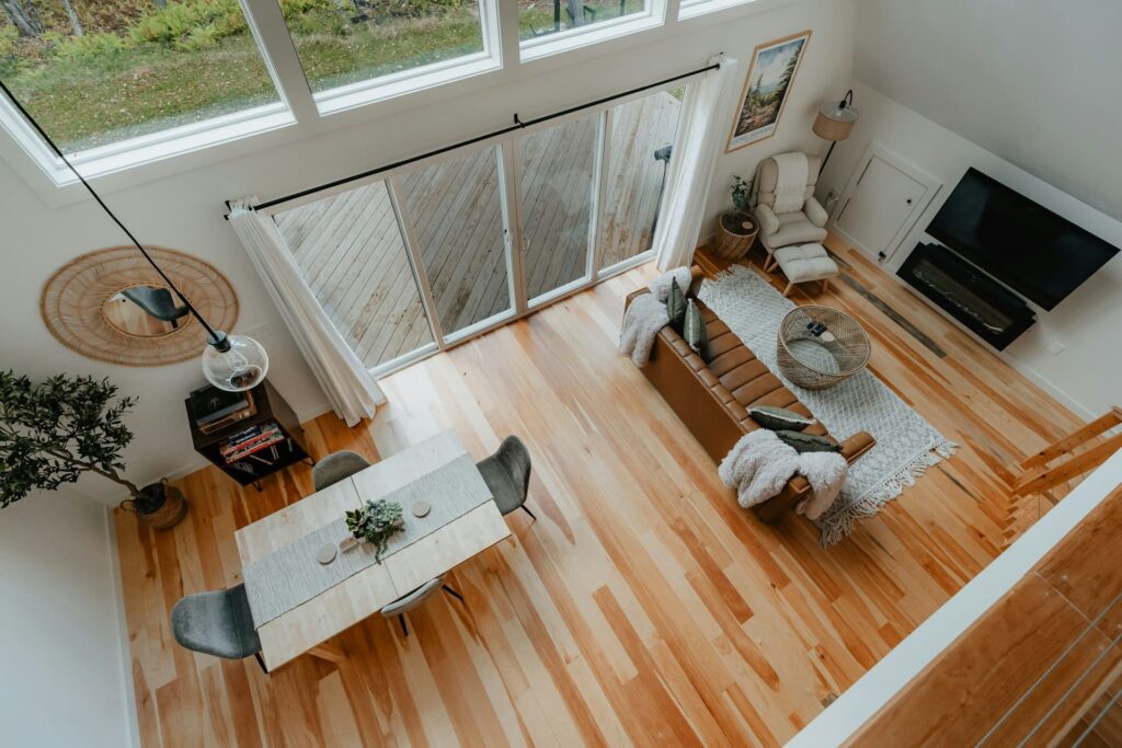 A photo of the living room taken from above, showing the distinctive home decor and beautiful wooden floors