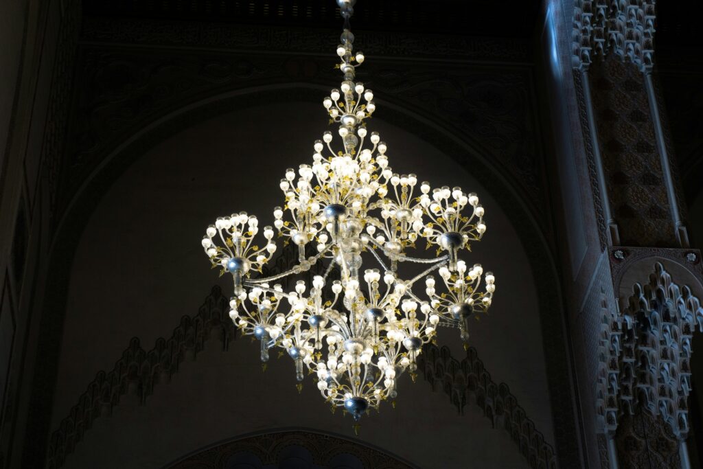 A decorative chandelier gracefully hanging from the ceiling, illuminating the space with its elegant lighting