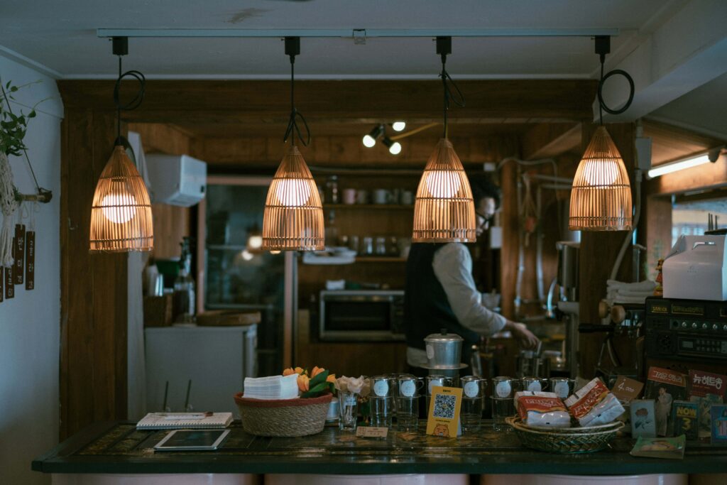 Man cooking in beautiful kitchen with modern kitchen lighting 