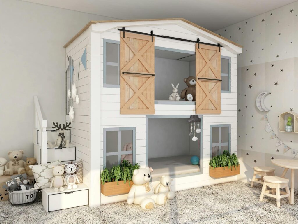 A children's bedroom featuring a bunk bed and a window, adorned with charming forest decorations.