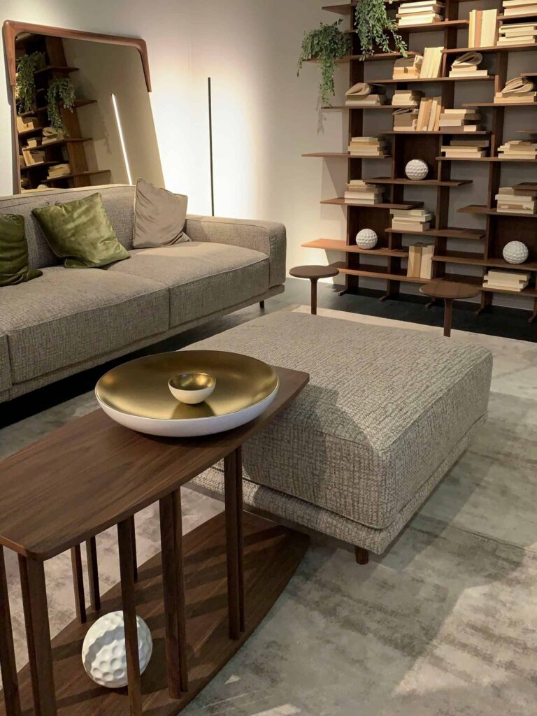 A cozy living room featuring a comfortable couch, a stylish coffee table, and well-stocked bookshelves.