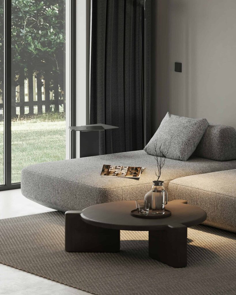 A contemporary living room featuring a stylish couch and a sleek coffee table, creating a cozy and inviting atmosphere.